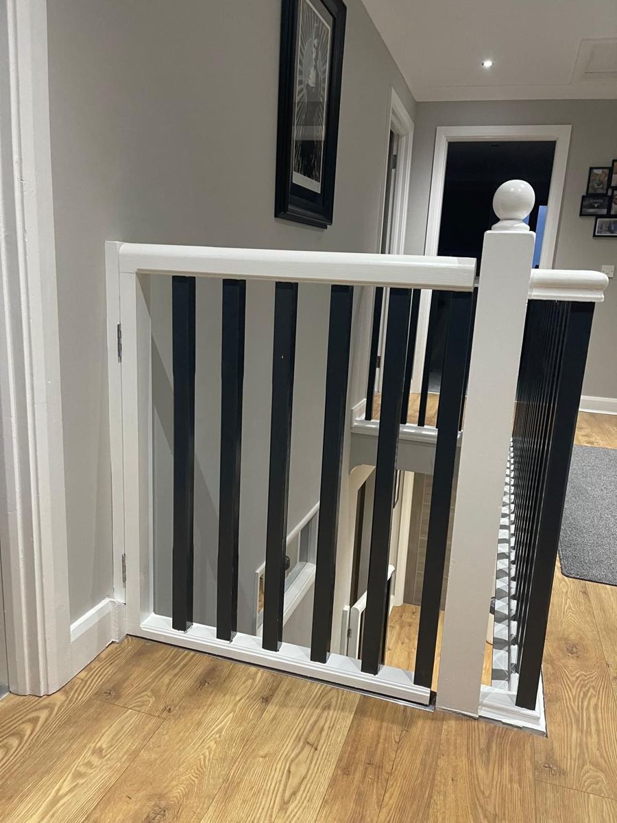 Matching bespoke gate across the top landing